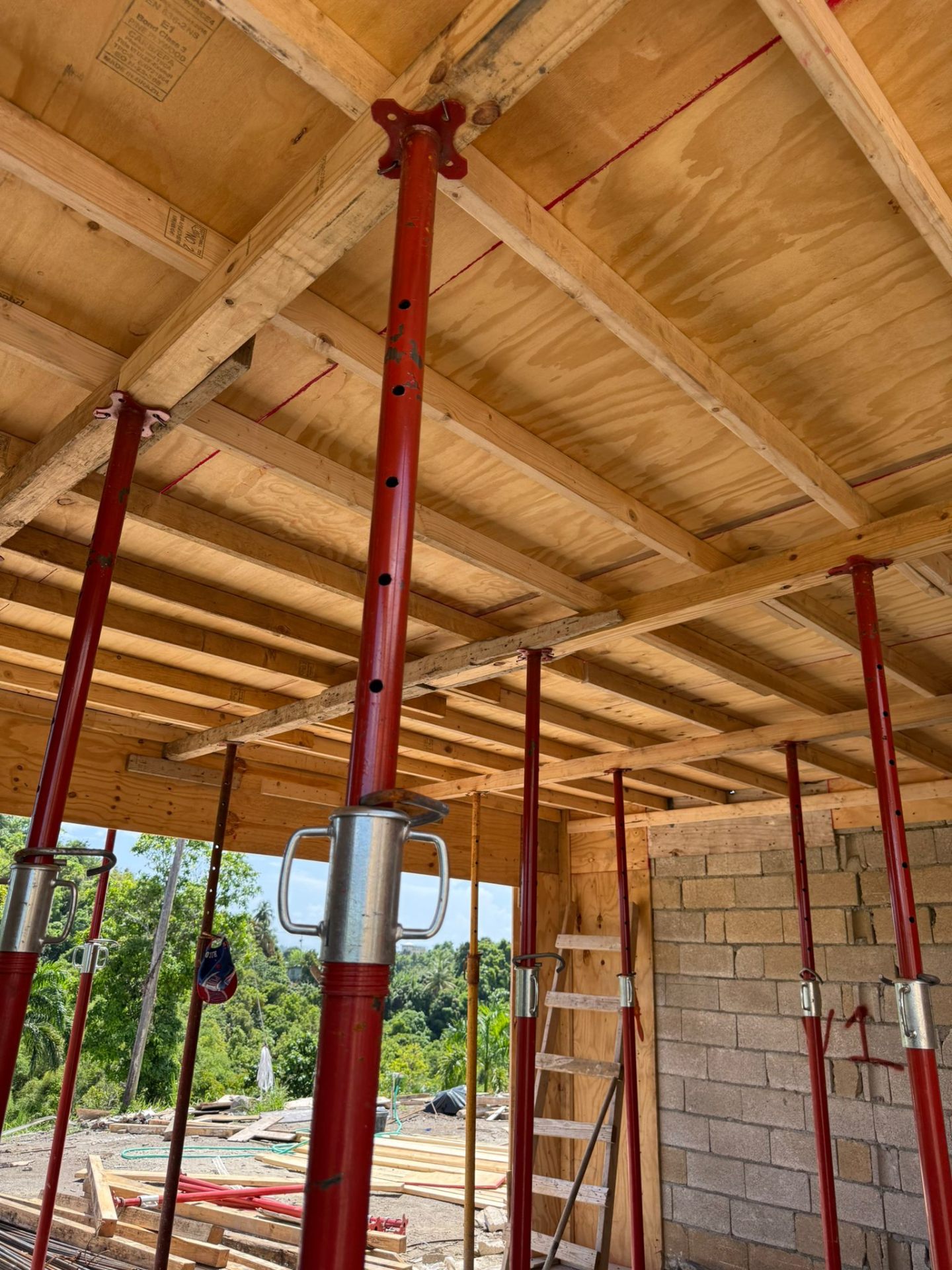 Concrete slab plywood formwork supported by props and beams